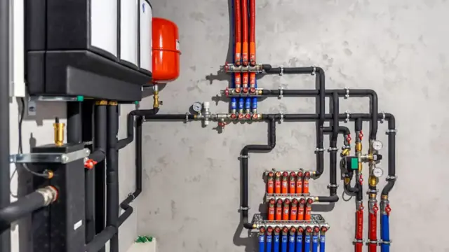 Boiler piping manifold with an expansion tank and colored supply lines