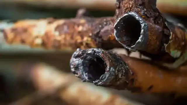 Corroded copper pipes with a split section